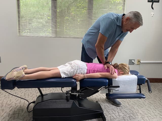 Dr. John Mistretta performing a gentle, specific chiropractic adjustment at Back 2 Health Chiropractic in Warren, Ohio